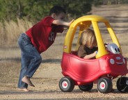 Kid pushing car